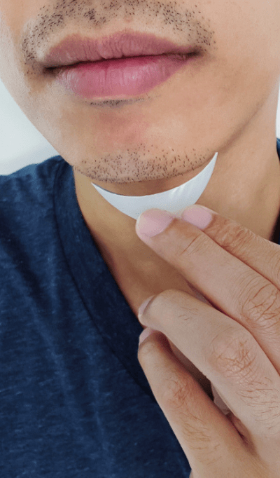 man holding a chin implant