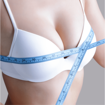 breast reduction surgery - woman measuring her breast